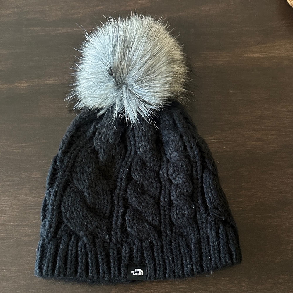 The North Face Women’s Black Cable Knit Beanie with Gray Pom-Pom